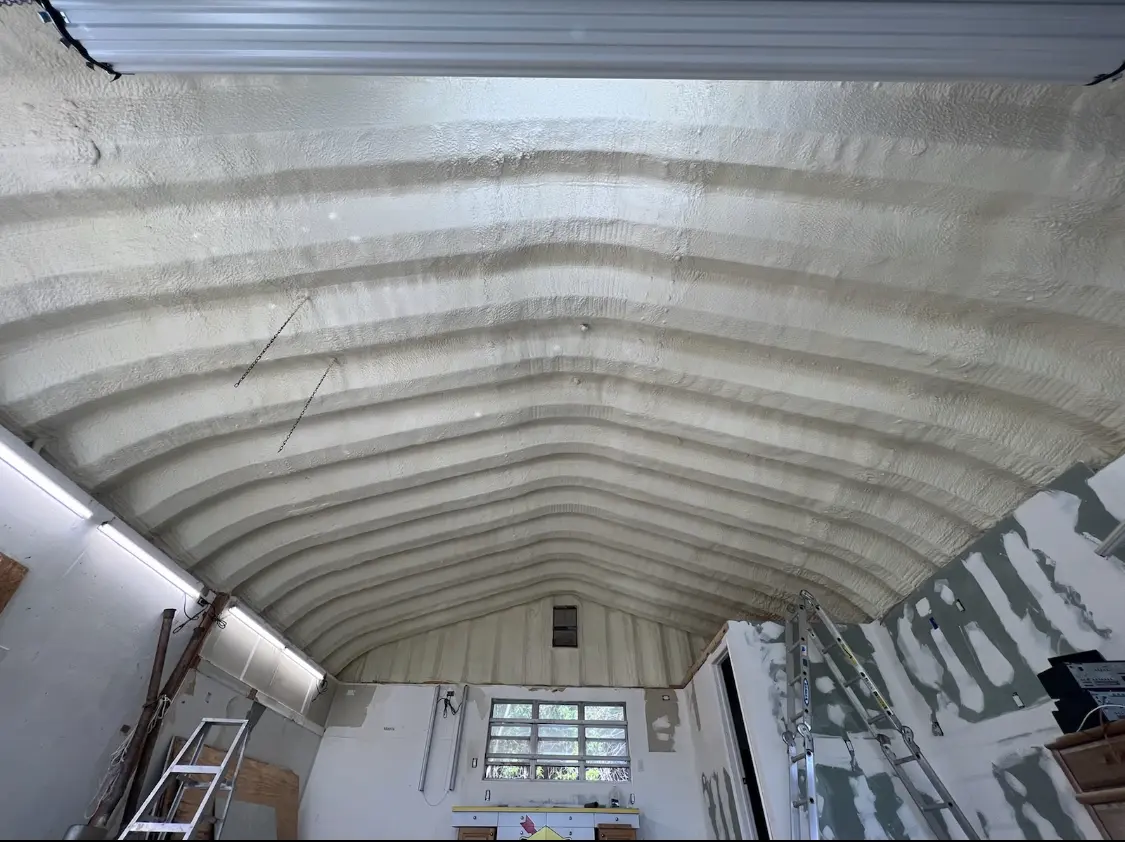 Spray polyurethane foam applied to the underside of a metal roof deck in Buckingham